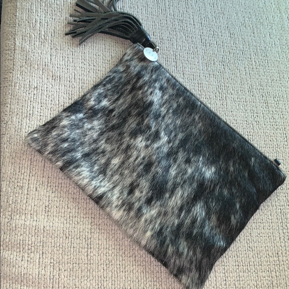 Vash Leather and Fur Clutch with a Tassel Zip Closure
